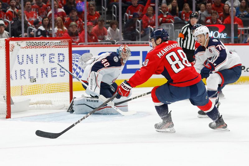 Nov 2, 2024; Washington, District of Columbia, USA; Washington Capitals left wing Andrew Mangiapane (88) scores a goal on Columbus Blue Jackets goaltender Daniil Tarasov (40) in the first period at Capital One Arena. Mandatory Credit: Geoff Burke-Imagn Images