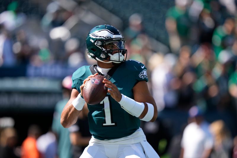 Philadelphia Eagles quarterback Jalen Hurts (1) warms up before an NFL football game against the Washington Commanders on Sunday, Oct. 1, 2023, in Philadelphia. (AP Photo/Matt Slocum)