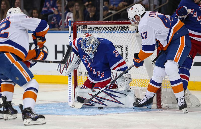 Sep 24, 2024; New York, New York, USA; New York Rangers goalie Igor Shesterkin (31) makes a save on New York Islanders forward Liam Foudy (47) during the second period at Madison Square Garden. Mandatory Credit: Danny Wild-Imagn Images