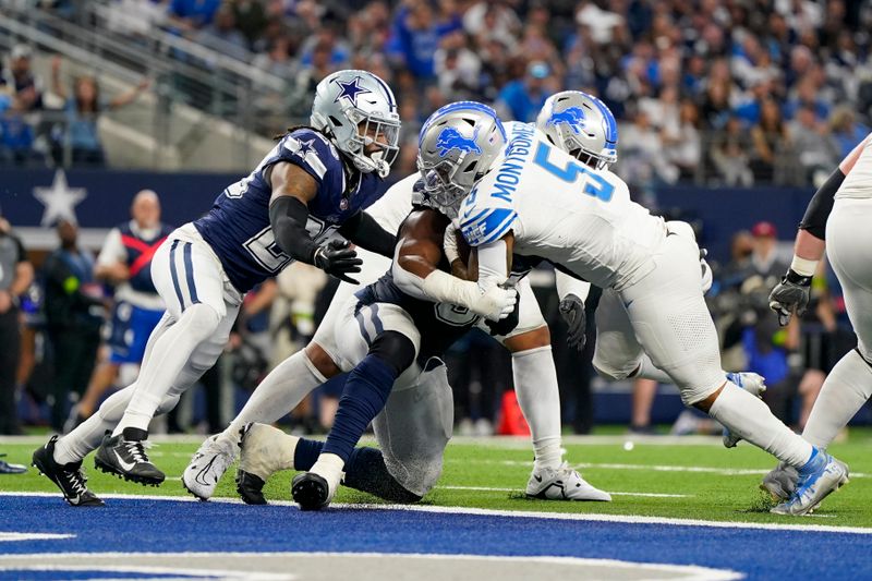 Detroit Lions running back David Montgomery (5) scores on a run against the Dallas Cowboys during the second half of an NFL football game, Saturday, Dec. 30, 2023, in Arlington, Texas. (AP Photo/Sam Hodde)