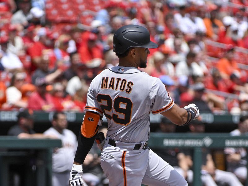 Jun 14, 2023; St. Louis, Missouri, USA;  San Francisco Giants center fielder Luis Matos (29) hits a single in his Major League debut against the St. Louis Cardinals during the first inning at Busch Stadium. Mandatory Credit: Jeff Curry-USA TODAY Sports