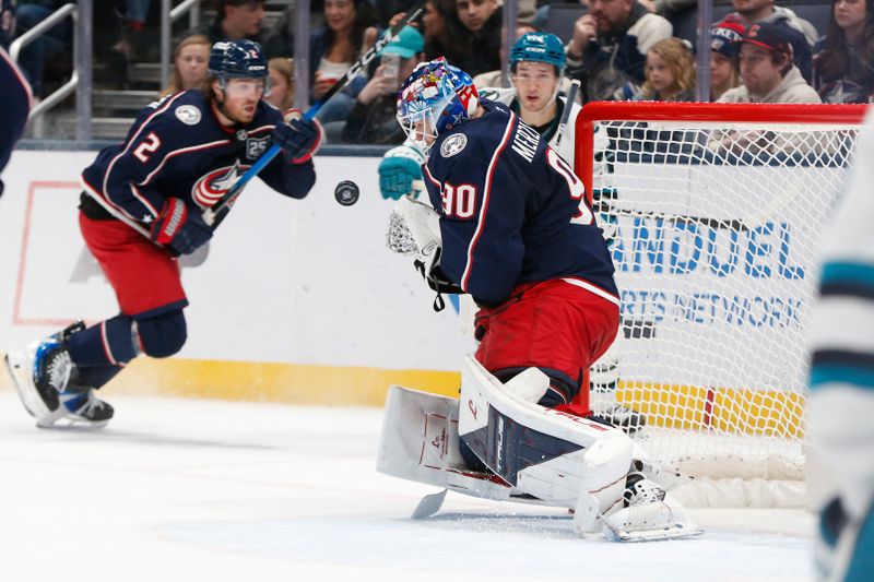 Mar 28, 2026; Columbus, Ohio, USA; Columbus Blue Jackets goalie Elvis Merzlikins (90) makes a save against the San Jose Sharks during the second period at Nationwide Arena. Mandatory Credit: Russell LaBounty-Imagn Images