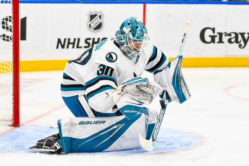 Nov 21, 2024; St. Louis, Missouri, USA;  San Jose Sharks goaltender Yaroslav Askarov (30) defends the net against the St. Louis Blues during the second period at Enterprise Center. Mandatory Credit: Jeff Curry-Imagn Images