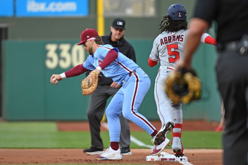 May 1, 2025; Philadelphia, Pennsylvania, USA; Philadelphia Phillies first base Bryce Harper (3) catches the ball barehanded to get Washington Nationals shortstop CJ Abrams (5) at first base at Citizens Bank Park. Mandatory Credit: Eric Hartline-Imagn Images