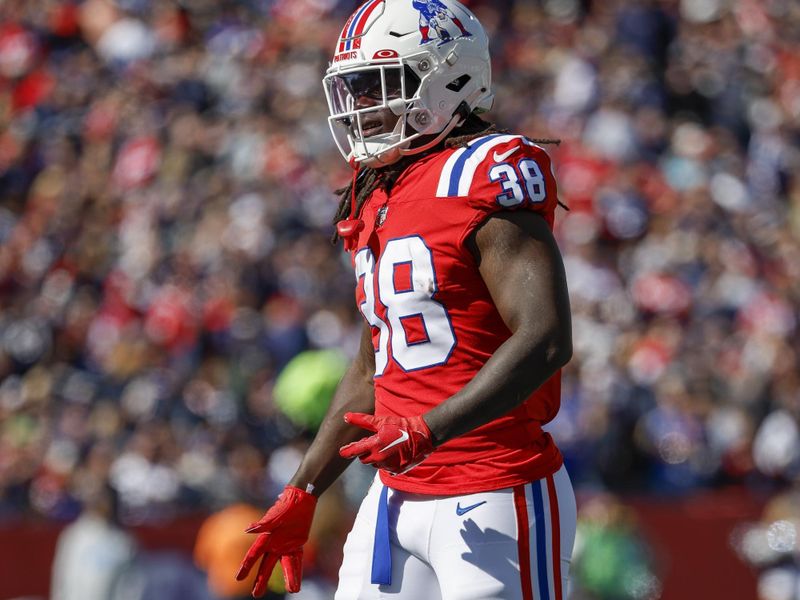 New England Patriots running back Rhamondre Stevenson (38) walks on the field during the first half of an NFL football game against the Detroit Lions, Sunday, Oct. 9, 2022, in Foxborough, Mass. (AP Photo/Greg M. Cooper)
