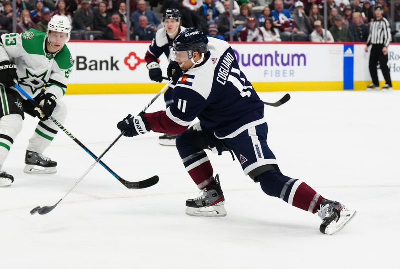 Feb 27, 2024; Denver, Colorado, USA; Colorado Avalanche center Andrew Cogliano (11) shoots and scores in the second period against the Dallas Stars at Ball Arena. Mandatory Credit: Ron Chenoy-USA TODAY Sports