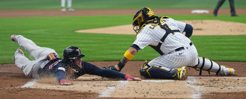 Apr 23, 2023; Milwaukee, Wisconsin, USA; Boston Red Sox's Alex Verdugo (99) beats a tag by Milwaukee Brewers catcher Victor Caratini (7) to score during the first inning at American Family Field. Mandatory Credit: Mark Hoffman-USA TODAY Sports