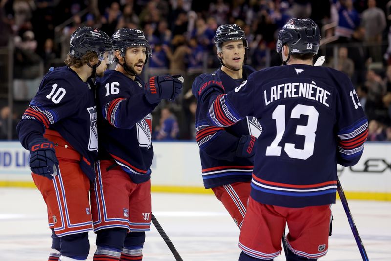 Dec 6, 2024; New York, New York, USA; New York Rangers center Vincent Trocheck (16) celebrates his goal against the Pittsburgh Penguins with left wing Artemi Panarin (10) and defenseman Braden Schneider (4) and left wing Alexis Lafreniere (13) during the third period at Madison Square Garden. Mandatory Credit: Brad Penner-Imagn Images