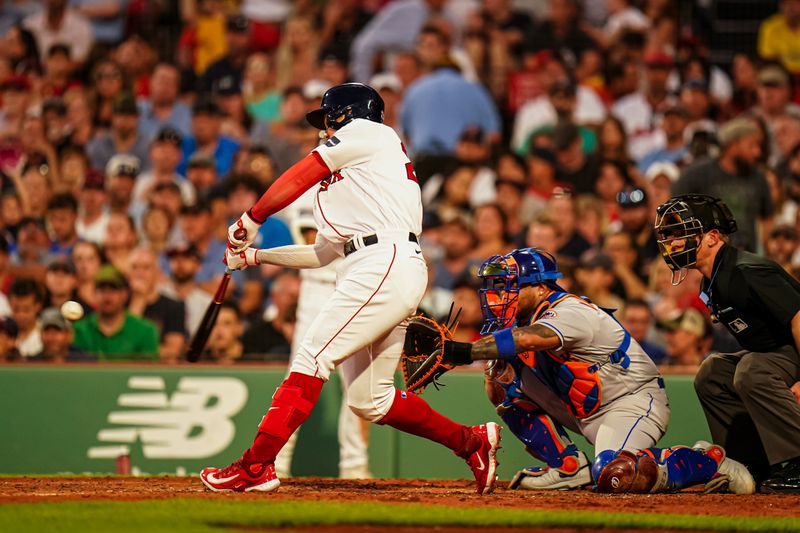 Jul 23, 2023; Boston, Massachusetts, USA; Boston Red Sox shortstop Yu Chang (20) singles to left to drive in a run against the New York Mets in the third inning at Fenway Park. Mandatory Credit: David Butler II-USA TODAY Sports