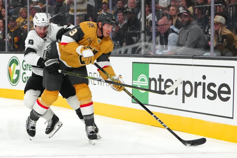 Oct 22, 2024; Las Vegas, Nevada, USA; Vegas Golden Knights defenseman Brayden McNabb (3) clears the puck away from Los Angeles Kings right wing Adrian Kempe (9) during the first period at T-Mobile Arena. Mandatory Credit: Stephen R. Sylvanie-Imagn Images