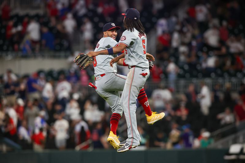 May 30, 2024; Atlanta, Georgia, USA; Washington Nationals left fielder Eddie Rosario (8) and shortstop CJ Abrams (5) celebrate after a victory against the Atlanta Braves at Truist Park. Mandatory Credit: Brett Davis-USA TODAY Sports