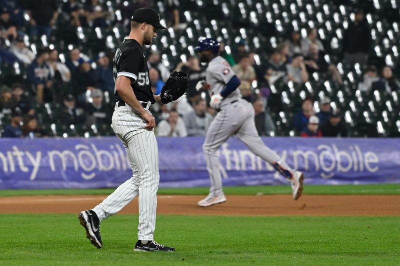 May 12, 2023; Chicago, Illinois, USA;  Chicago White Sox relief pitcher Jimmy Lambert (58) looks on after Houston Astros left fielder Yordan Alvarez (44) hits a home run during the eighth inning at Guaranteed Rate Field. Mandatory Credit: Matt Marton-USA TODAY Sports