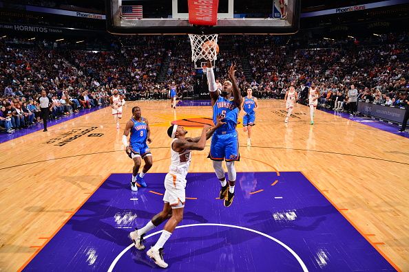 PHOENIX, AZ - NOVEMBER 12: Luguentz Dort #5 of the Oklahoma City Thunder drives to the basket during the game against the Phoenix Suns on November 12, 2023 at Footprint Center in Phoenix, Arizona. NOTE TO USER: User expressly acknowledges and agrees that, by downloading and or using this photograph, user is consenting to the terms and conditions of the Getty Images License Agreement. Mandatory Copyright Notice: Copyright 2023 NBAE (Photo by Barry Gossage/NBAE via Getty Images)