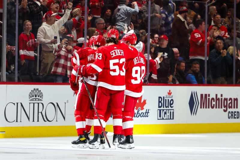 Oct 22, 2023; Detroit, Michigan, USA;  Detroit Red Wings right wing Alex DeBrincat (93) receives congratulations from teammates after scoring in the third period against the Calgary Flames at Little Caesars Arena. Mandatory Credit: Rick Osentoski-USA TODAY Sports