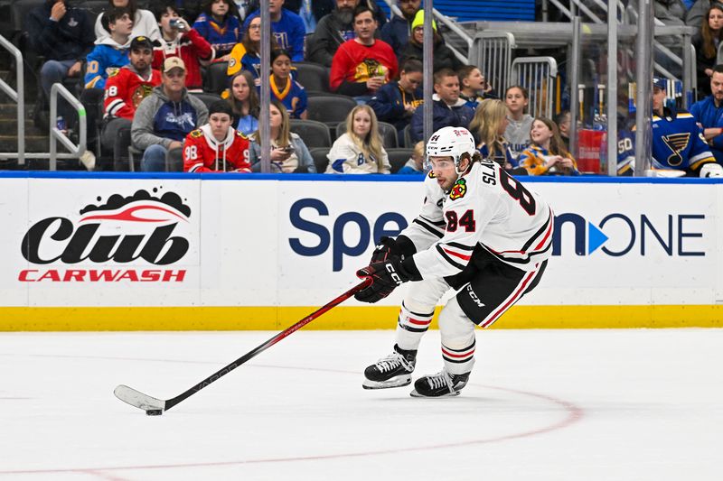 Apr 10, 2024; St. Louis, Missouri, USA;  Chicago Blackhawks left wing Landon Slaggert (84) controls the puck against the St. Louis Blues during the third period at Enterprise Center. Mandatory Credit: Jeff Curry-USA TODAY Sports