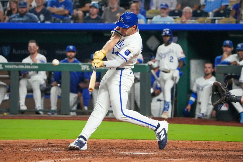 Sep 17, 2025; Kansas City, Missouri, USA; Kansas City Royals right fielder Jac Caglianone (14) hits a double agains the Seattle Mariners during the eighth inning at Kauffman Stadium. Mandatory Credit: Denny Medley-Imagn Images