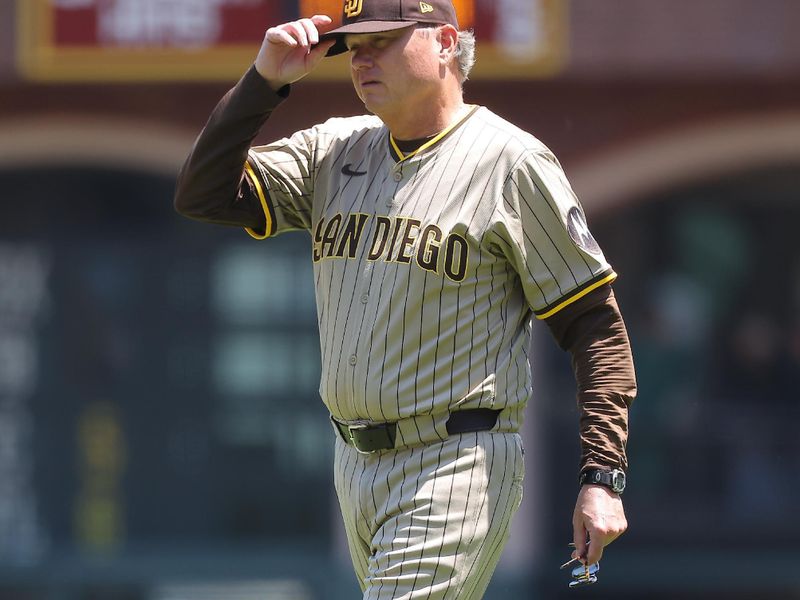 Jun 5, 2025; San Francisco, California, USA; San Diego Padres manager Mike Shildt (8) walks onto the field after the pitcher was hit by a San Francisco Giants single during the fifth inning at Oracle Park. Mandatory Credit: Kelley L Cox-Imagn Images