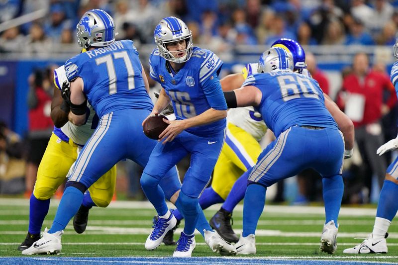 Detroit Lions quarterback Jared Goff (16) looks to handoff during an NFL wild-card football game against the Los Angeles Rams, Sunday, Jan. 14, 2024 in Detroit. Lions won 24-23. (AP Photo/Vera Nieuwenhuis)