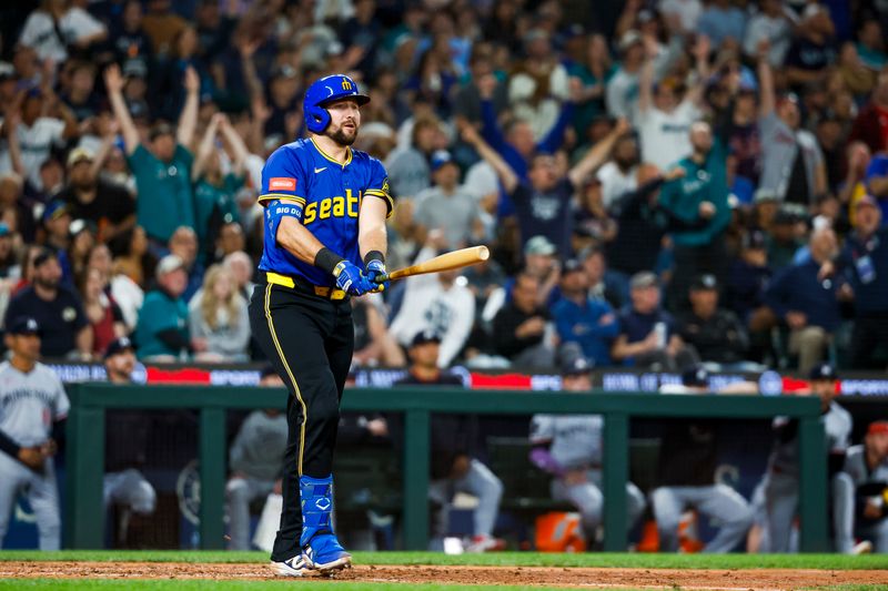 May 30, 2025; Seattle, Washington, USA; Seattle Mariners catcher Cal Raleigh (29) hits a two-run home run against the Minnesota Twins during the eighth inning at T-Mobile Park. Mandatory Credit: Joe Nicholson-Imagn Images