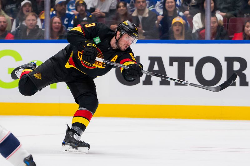 Jan 27, 2024; Vancouver, British Columbia, CAN; Vancouver Canucks forward J.T. Miller (9) shoots against the Columbus Blue Jackets in the second period at Rogers Arena. Mandatory Credit: Bob Frid-USA TODAY Sports