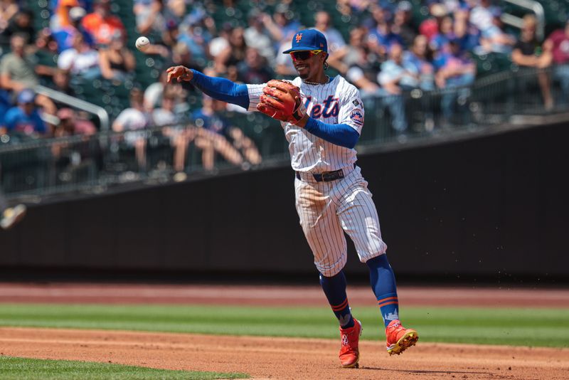 Aug 21, 2024; New York City, New York, USA; New York Mets shortstop Francisco Lindor (12) throws the ball to first base for an out during the second inning against the Baltimore Orioles at Citi Field. Mandatory Credit: Vincent Carchietta-USA TODAY Sports