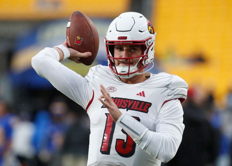 Oct 14, 2023; Pittsburgh, Pennsylvania, USA;  Louisville Cardinals quarterback Jack Plummer (13) warms up before the game against the Pittsburgh Panthers at Acrisure Stadium. Mandatory Credit: Charles LeClaire-USA TODAY Sports