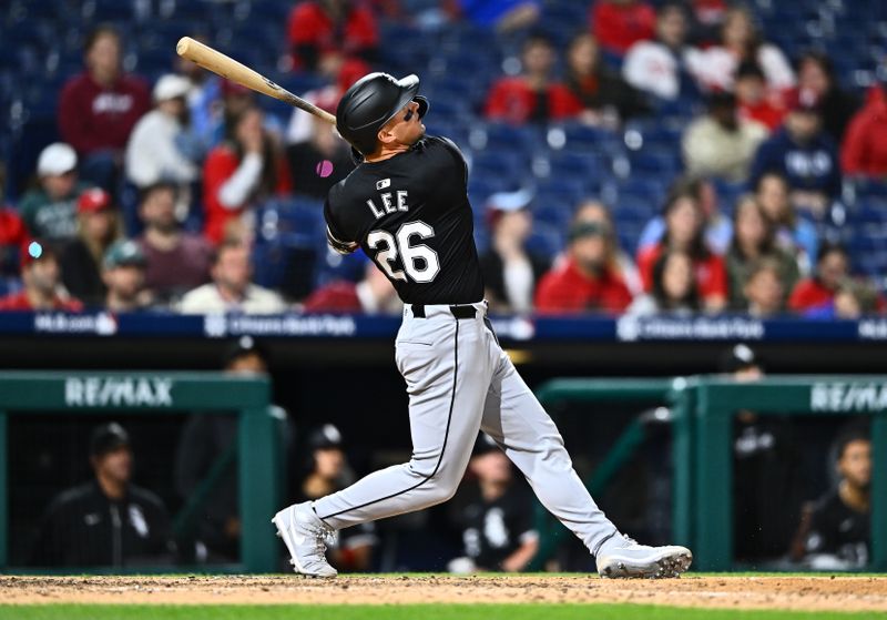 Apr 20, 2024; Philadelphia, Pennsylvania, USA; Chicago White Sox catcher Korey Lee (26) hits an RBI double against the Philadelphia Phillies in the ninth inning at Citizens Bank Park. Mandatory Credit: Kyle Ross-USA TODAY Sports