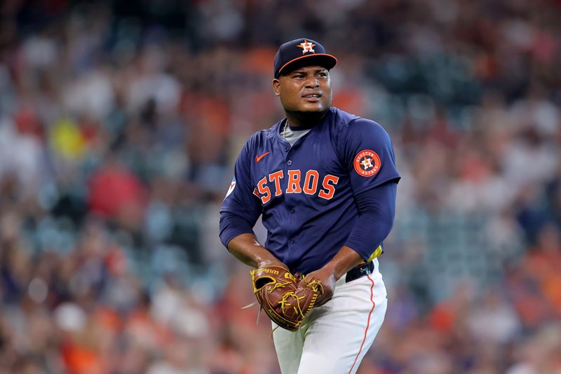 Jun 1, 2024; Houston, Texas, USA; Houston Astros starting pitcher Framber Valdez (59) reacts after throwing a strikeout against the Minnesota Twins during the first inning at Minute Maid Park. Mandatory Credit: Erik Williams-USA TODAY Sports