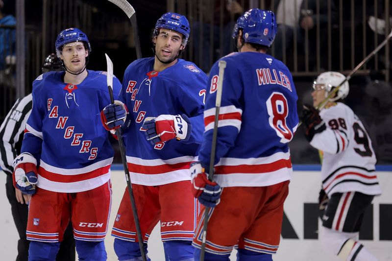 Mar 27, 2026; New York, New York, USA; New York Rangers defenseman Matthew Robertson (29) celebrates his goal against the Chicago Blackhawks with left wing Tye Kartye (24) and left wing J.T. Miller (8) during the second period at Madison Square Garden. Mandatory Credit: Brad Penner-Imagn Images