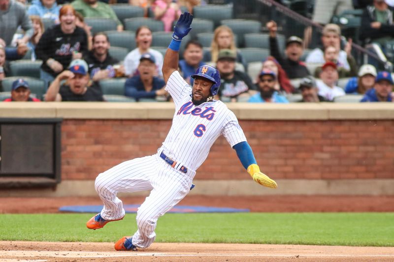 Jun 3, 2023; New York City, New York, USA;  New York Mets right fielder Starling Marte (6) slides into home to score in the second inning against the Toronto Blue Jays at Citi Field. Mandatory Credit: Wendell Cruz-USA TODAY Sports