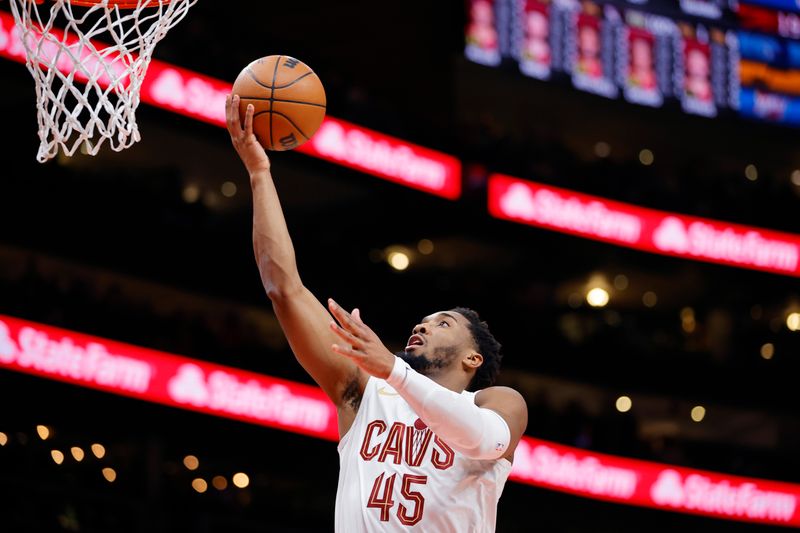 ATLANTA, GEORGIA - JANUARY 20: Donovan Mitchell #45 of the Cleveland Cavaliers shoots against the Atlanta Hawks during the first half at State Farm Arena on January 20, 2024 in Atlanta, Georgia. NOTE TO USER: User expressly acknowledges and agrees that, by downloading and or using this photograph, User is consenting to the terms and conditions of the Getty Images License Agreement. (Photo by Alex Slitz/Getty Images)