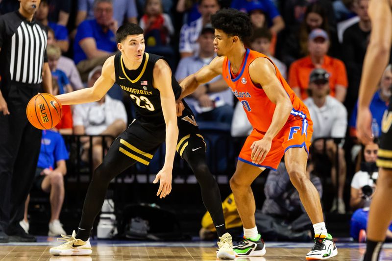 Feb 24, 2024; Gainesville, Florida, USA; Vanderbilt Commodores guard Jason Rivera-Torres (23) posts up against Florida Gators guard Zyon Pullin (0) during the second half at Exactech Arena at the Stephen C. O'Connell Center. Mandatory Credit: Matt Pendleton-USA TODAY Sports