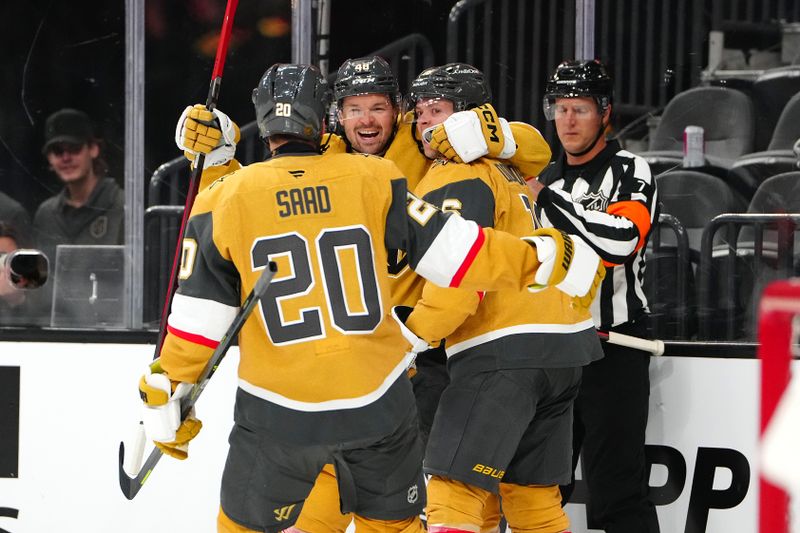 Oct 8, 2025; Las Vegas, Nevada, USA; Vegas Golden Knights right wing Pavel Dorofeyev (16) celebrates with center Tomas Hertl (48) and left wing Brandon Saad (20) after scoring a goal against the Los Angeles Kings during the second period at T-Mobile Arena. Mandatory Credit: Stephen R. Sylvanie-Imagn Images