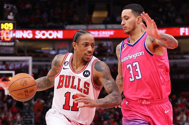 CHICAGO, ILLINOIS - FEBRUARY 26: DeMar DeRozan #11 of the Chicago Bulls drives to the basket against Kyle Kuzma #33 of the Washington Wizards during the second half at United Center on February 26, 2023 in Chicago, Illinois. NOTE TO USER: User expressly acknowledges and agrees that, by downloading and or using this photograph, User is consenting to the terms and conditions of the Getty Images License Agreement.  (Photo by Michael Reaves/Getty Images)