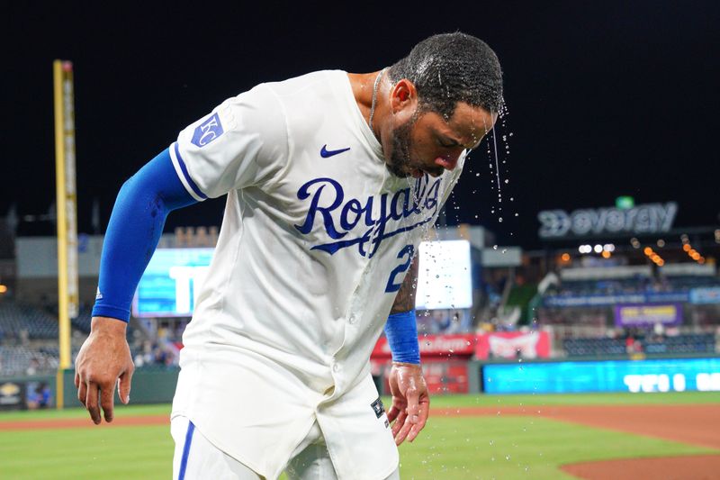 Sep 4, 2024; Kansas City, Missouri, USA; Kansas City Royals right fielder Tommy Pham (22) shakes off after being doused after the win over the Cleveland Guardians at Kauffman Stadium. Mandatory Credit: Denny Medley-Imagn Images