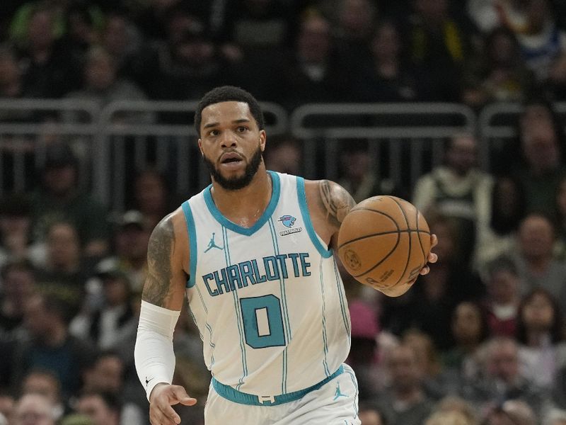 MILWAUKEE, WISCONSIN - FEBRUARY 27: Miles Bridges #0 of the Charlotte Hornets dribbles the ball during the first half against the Milwaukee Bucks at Fiserv Forum on February 27, 2024 in Milwaukee, Wisconsin. NOTE TO USER: User expressly acknowledges and agrees that, by downloading and or using this photograph, User is consenting to the terms and conditions of the Getty Images License Agreement. (Photo by Patrick McDermott/Getty Images)