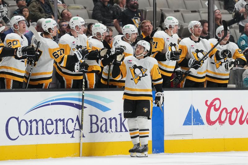 Nov 4, 2023; San Jose, California, USA; Pittsburgh Penguins center Vinnie Hinostroza (13) is congratulated by teammates after scoring a goal against the San Jose Sharks during the second period at SAP Center at San Jose. Mandatory Credit: Darren Yamashita-USA TODAY Sports