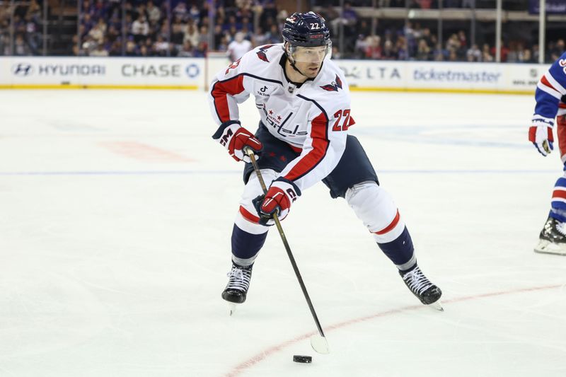 Oct 12, 2025; New York, New York, USA;  Washington Capitals right wing Brandon Duhaime (22) controls the puck in the third period against the New York Rangers at Madison Square Garden. Mandatory Credit: Wendell Cruz-Imagn Images