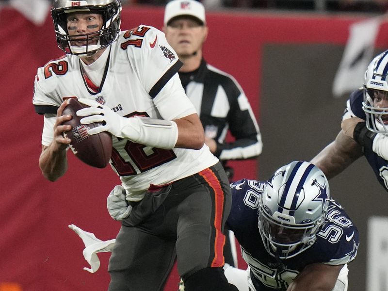 Tampa Bay Buccaneers quarterback Tom Brady (12) works under pressure against Dallas Cowboys during the first half of an NFL wild-card football game, Monday, Jan. 16, 2023, in Tampa, Fla. (AP Photo/Chris O'Meara)