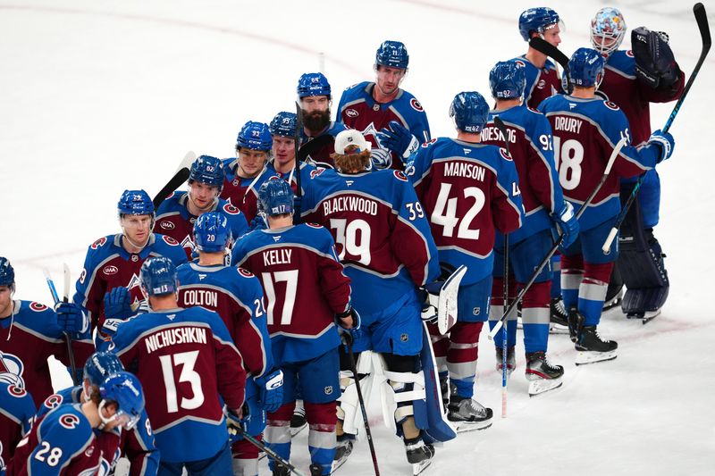 Oct 31, 2025; Las Vegas, Nevada, USA; Colorado Avalanche players celebrate after defeating the Vegas Golden Knights 4-2 at T-Mobile Arena. Mandatory Credit: Stephen R. Sylvanie-Imagn Images