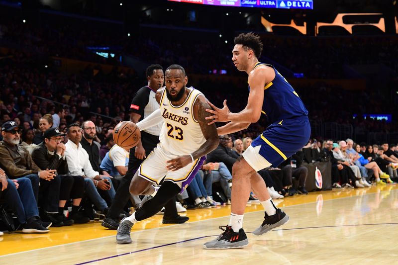 LOS ANGELES, CA - MACH 16: LeBron James #23 of the Los Angeles Lakers dribbles the ball during the game against the Golden State Warriors on March 16, 2024 at Crypto.Com Arena in Los Angeles, California. NOTE TO USER: User expressly acknowledges and agrees that, by downloading and/or using this Photograph, user is consenting to the terms and conditions of the Getty Images License Agreement. Mandatory Copyright Notice: Copyright 2024 NBAE (Photo by Adam Pantozzi/NBAE via Getty Images)