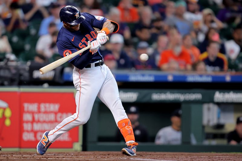 Jun 1, 2024; Houston, Texas, USA; Houston Astros shortstop Jeremy Pena (3) hits a single against the Minnesota Twins during the first inning at Minute Maid Park. Mandatory Credit: Erik Williams-USA TODAY Sports