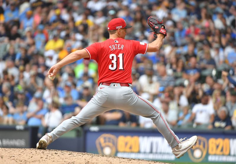 Jun 15, 2024; Milwaukee, Wisconsin, USA; Cincinnati Reds relief pitcher Brent Suter (31) delivers a pitch against the Milwaukee Brewers in the eighth inning at American Family Field. Mandatory Credit: Michael McLoone-USA TODAY Sports