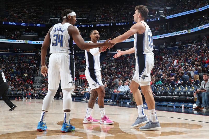 NEW ORLEANS, LA - APRIL 3:  Franz Wagner #22 of the Orlando Magic is congratulated during the game against the New Orleans Pelicans on April 3, 2024 at the Smoothie King Center in New Orleans, Louisiana. NOTE TO USER: User expressly acknowledges and agrees that, by downloading and or using this Photograph, user is consenting to the terms and conditions of the Getty Images License Agreement. Mandatory Copyright Notice: Copyright 2024 NBAE (Photo by Layne Murdoch Jr./NBAE via Getty Images)