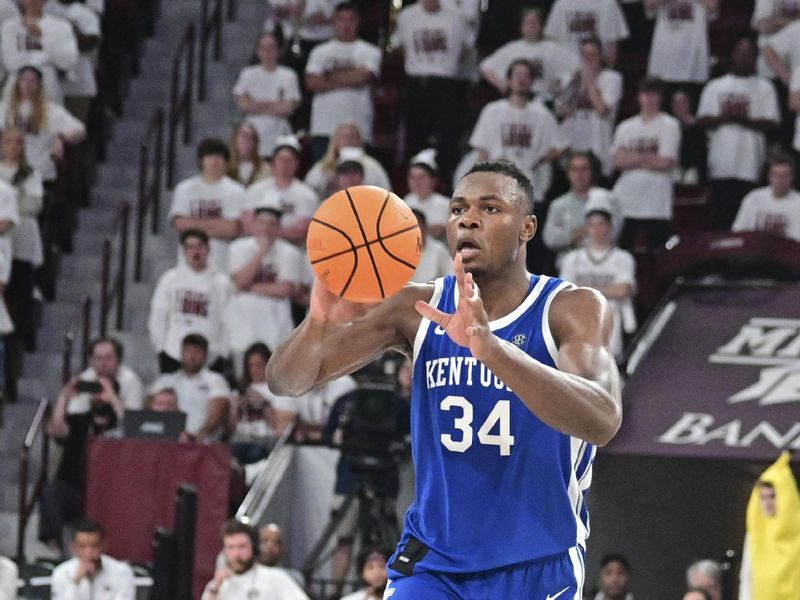 Feb 15, 2023; Starkville, Mississippi, USA; Kentucky Wildcats forward Oscar Tshiebwe (34) handles the ball against the Mississippi State Bulldogs during the second half  at Humphrey Coliseum. Mandatory Credit: Matt Bush-USA TODAY Sports