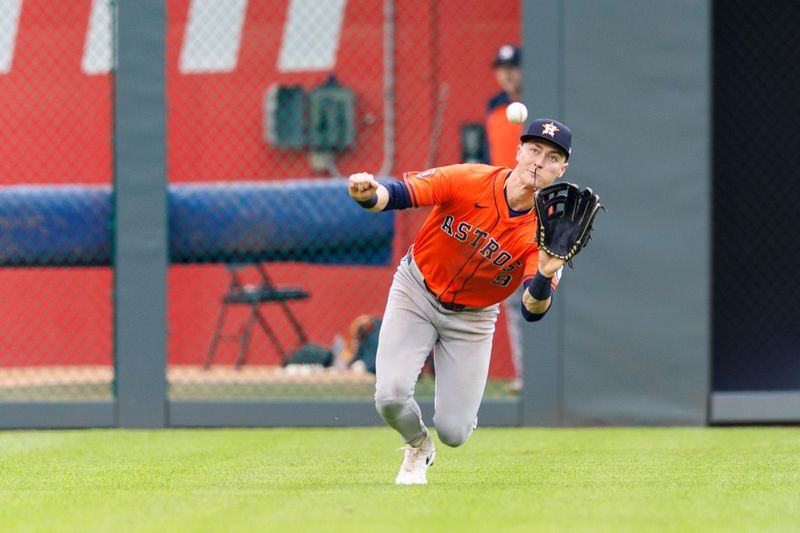 Apr 27, 2025; Kansas City, Missouri, USA; Houston Astros outfielder Zach Dezenzo (9) dives for a ball during the eighth inning against the Kansas City Royals at Kauffman Stadium. Mandatory Credit: William Purnell-Imagn Images