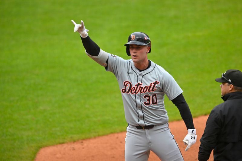 Oct 12, 2024; Cleveland, Ohio, USA; Detroit Tigers outfielder Kerry Carpenter (30) celebrates in the fifth inning against the Cleveland Guardians during game five of the ALDS for the 2024 MLB Playoffs at Progressive Field. Mandatory Credit: David Richard-Imagn Images