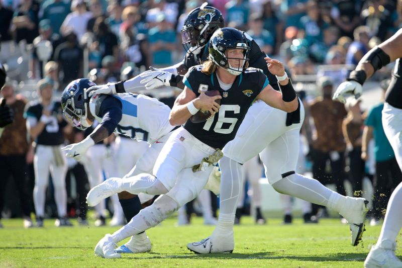 Jacksonville Jaguars quarterback Trevor Lawrence (16) scrambles for yardage during the first half of an NFL football game against the Tennessee Titans, Sunday, Nov. 19, 2023, in Jacksonville, Fla. (AP Photo/Phelan M. Ebenhack)