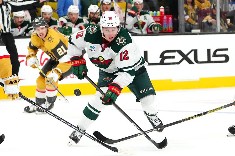 Feb 12, 2024; Las Vegas, Nevada, USA; Minnesota Wild left wing Matt Boldy (12) skates against the Vegas Golden Knights during the second period at T-Mobile Arena. Mandatory Credit: Stephen R. Sylvanie-USA TODAY Sports