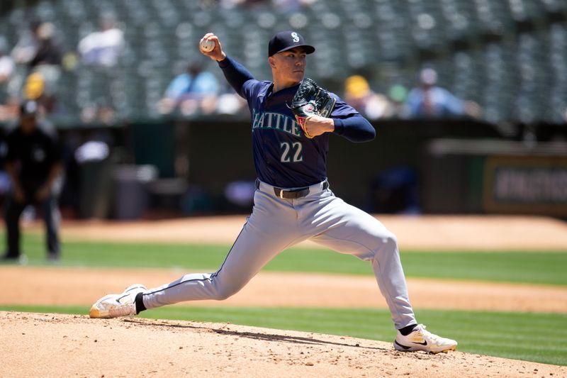 Jun 6, 2024; Oakland, California, USA; Seattle Mariners starting pitcher Bryan Woo (22) delivers a pitch against the Oakland Athletics during the second inning at Oakland-Alameda County Coliseum. Mandatory Credit: D. Ross Cameron-USA TODAY Sports